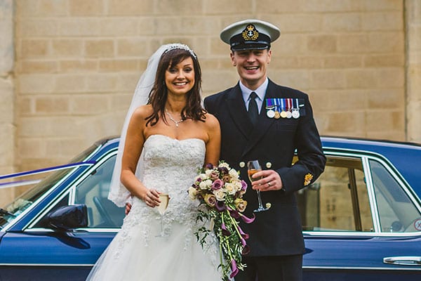 Newly-wed couple in front of Bentley Brooklands