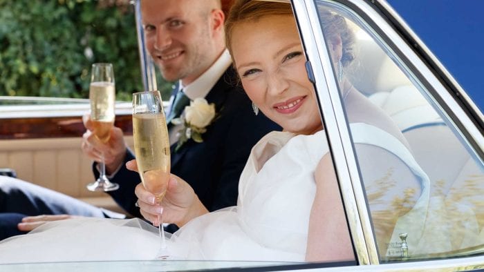 James and Jen with their celebratory glass of Champagne in the Bentley Brooklands