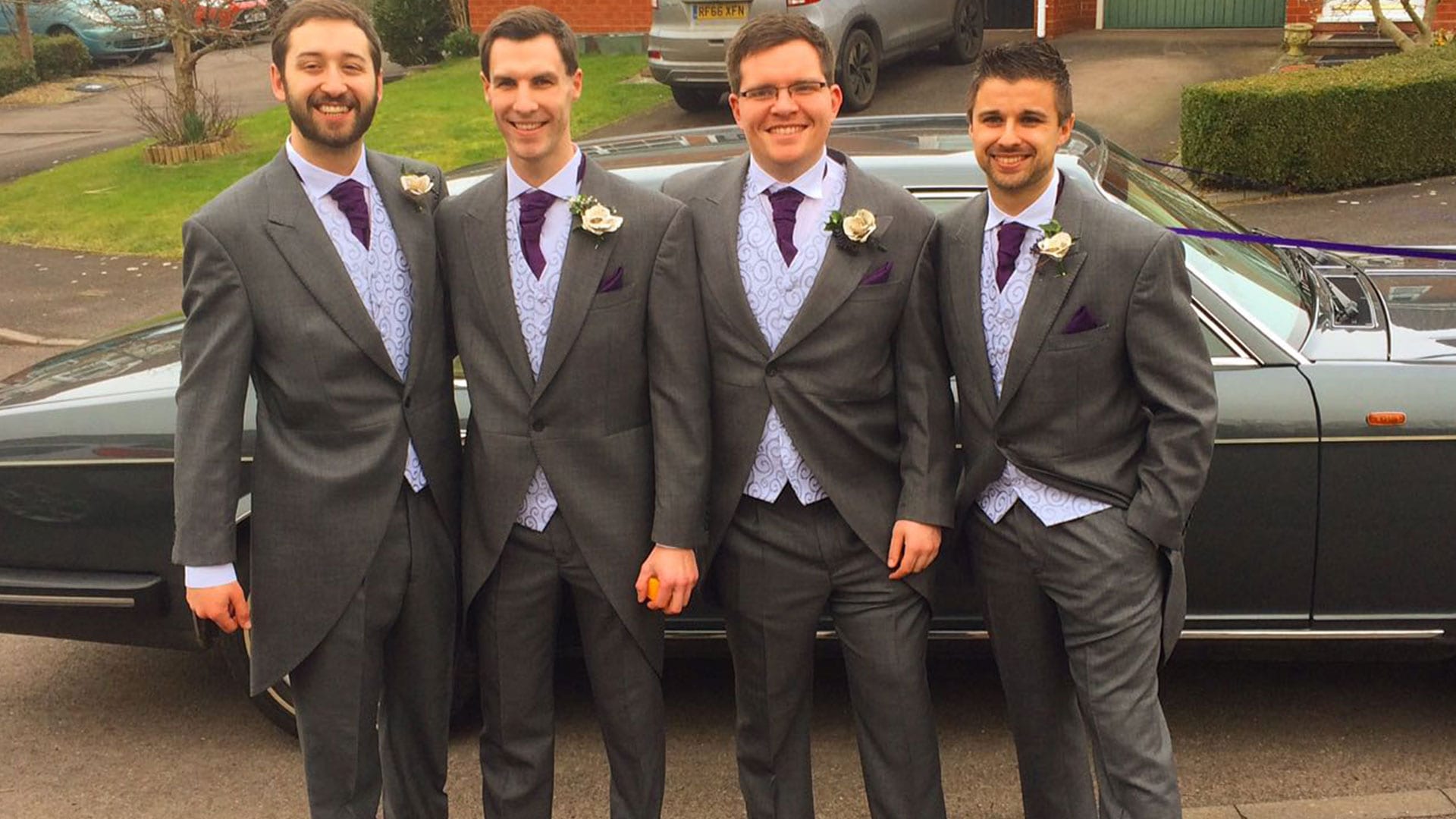 The Groom and his Groomsmen with the Rolls-Royce Flying Spur