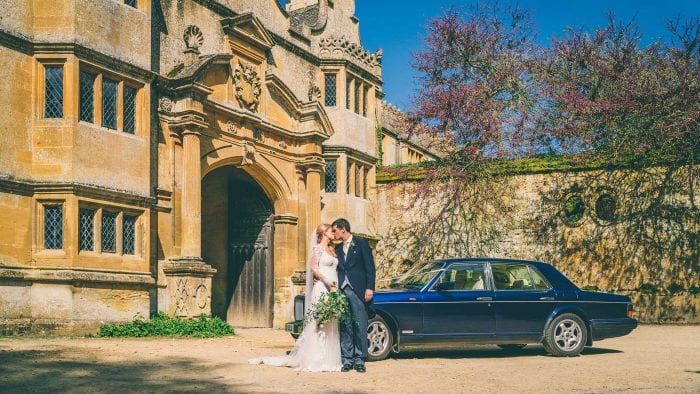 Newly-weds Robyn and Mike at Stanway House with the Bentley Brooklands
