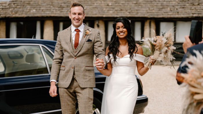 Bride and groom with the Bentley Arnage wedding car